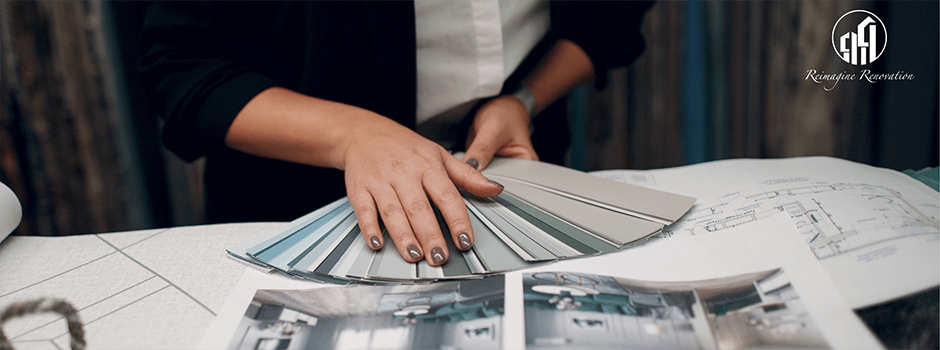A woman holding color and fabric swatches for an interior design project