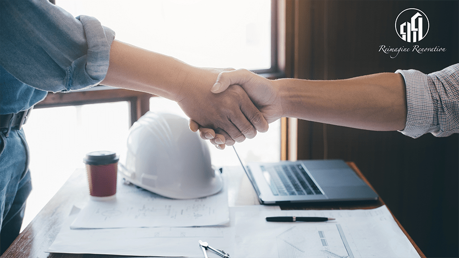 Homeowner and contractor shaking hands on a new deal